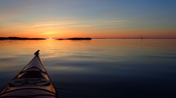 A stunning sunset on a calm sea seen from a kayak