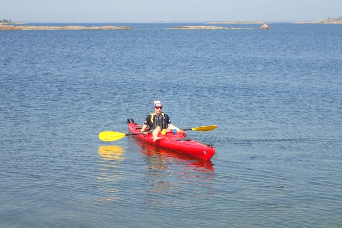 A paddler learning some basic techniques on her kayak